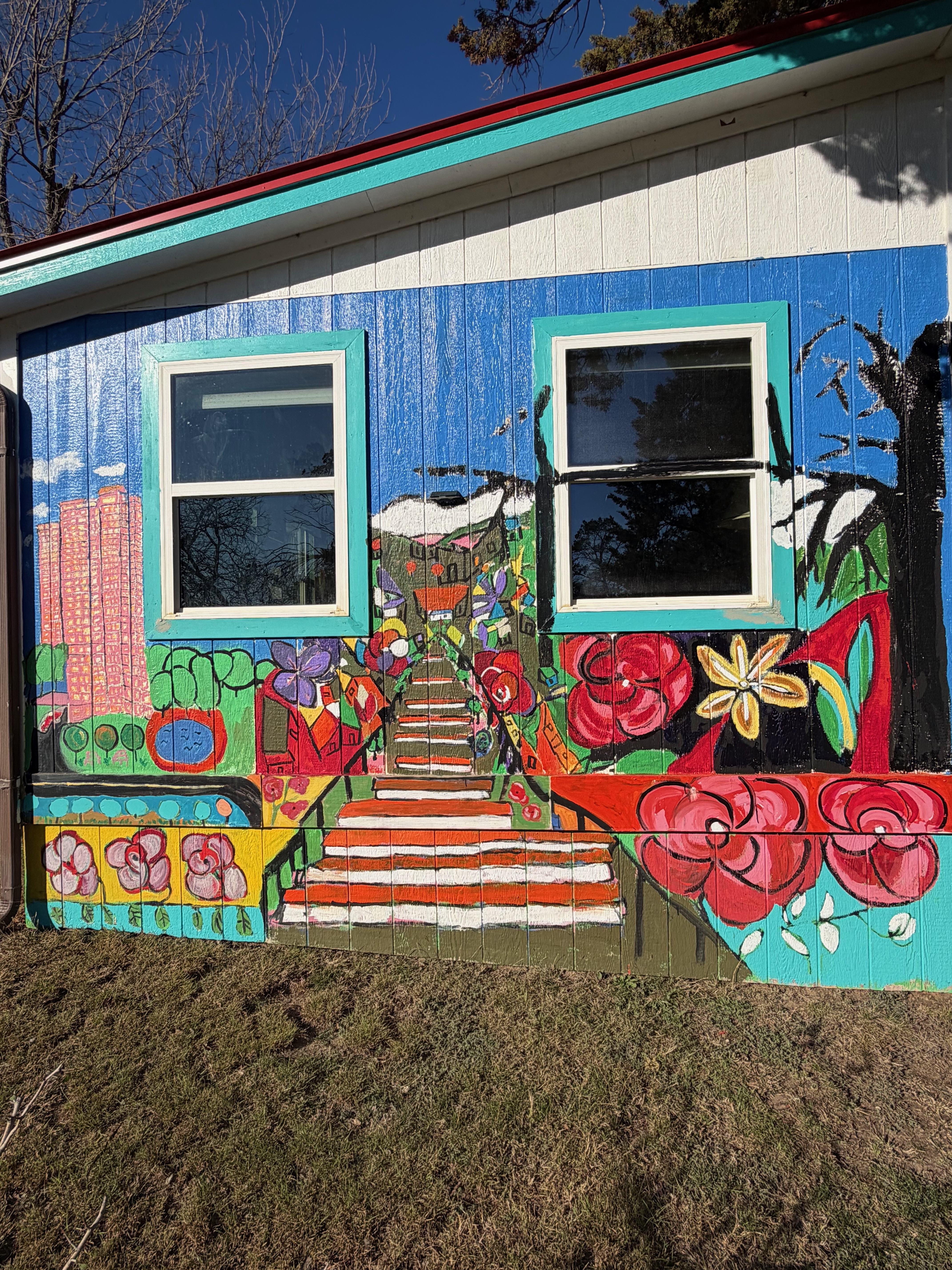 Exterior mural — flowers and stairway